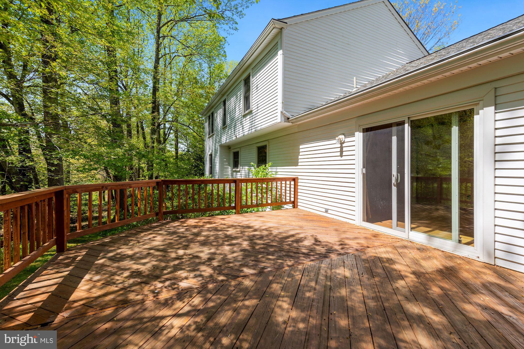11321 Classical Lane Silver Spring, MD 20901 - Photo 28 of 35 a balcony with a potted plant and large windows