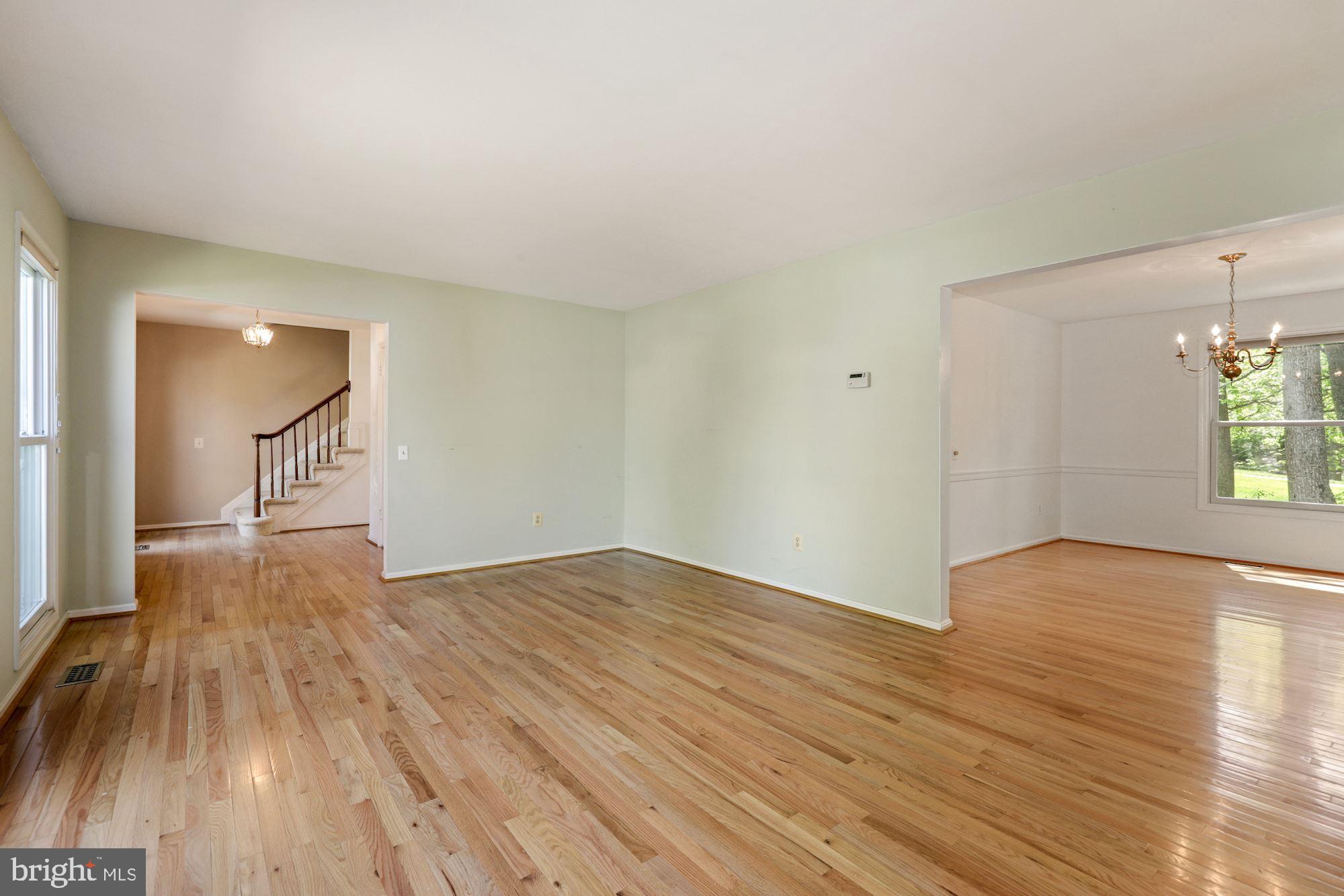 11321 Classical Lane Silver Spring, MD 20901 - Photo 7 of 35 wooden floor in an empty room with a window