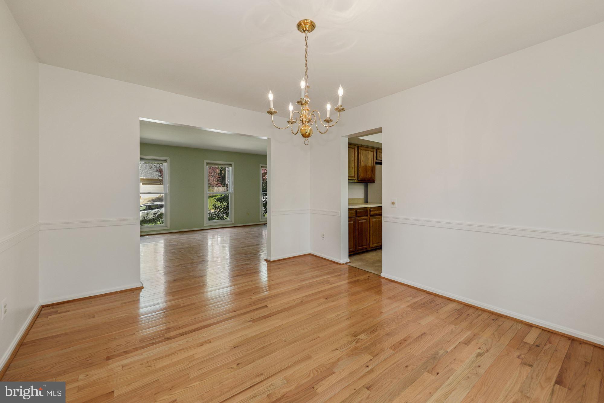 11321 Classical Lane Silver Spring, MD 20901 - Photo 9 of 35 wooden floor in an empty room with a window
