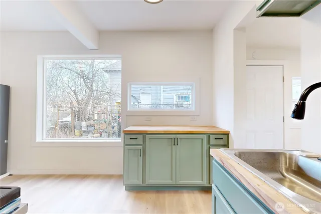 a kitchen with a cabinets and a sink