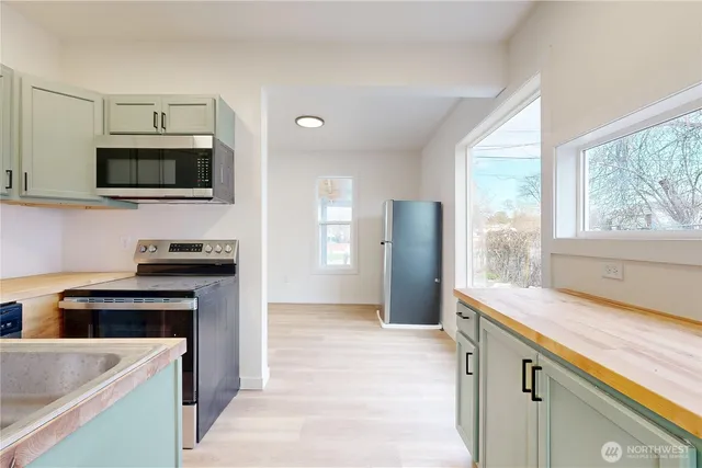 a kitchen with a stove and a sink