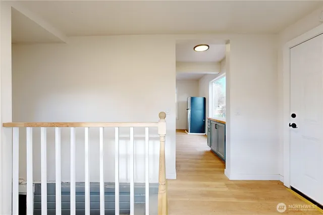 a view of a hallway view with wooden floor and staircase