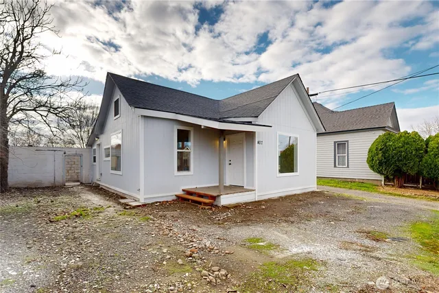 a house with trees in the background