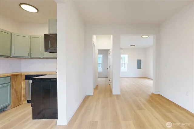 a view of a kitchen from the hallway