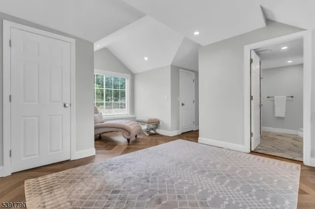 a room with a bed and a window