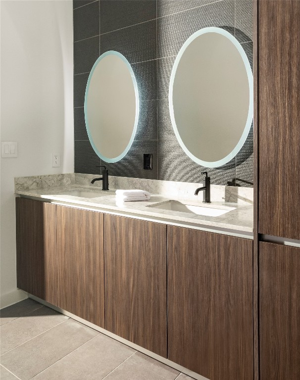 2209 South 1st Street, Unit 408 Austin, TX 78704 - Photo 12 of 28 a bathroom with a toilet mirror and vanity