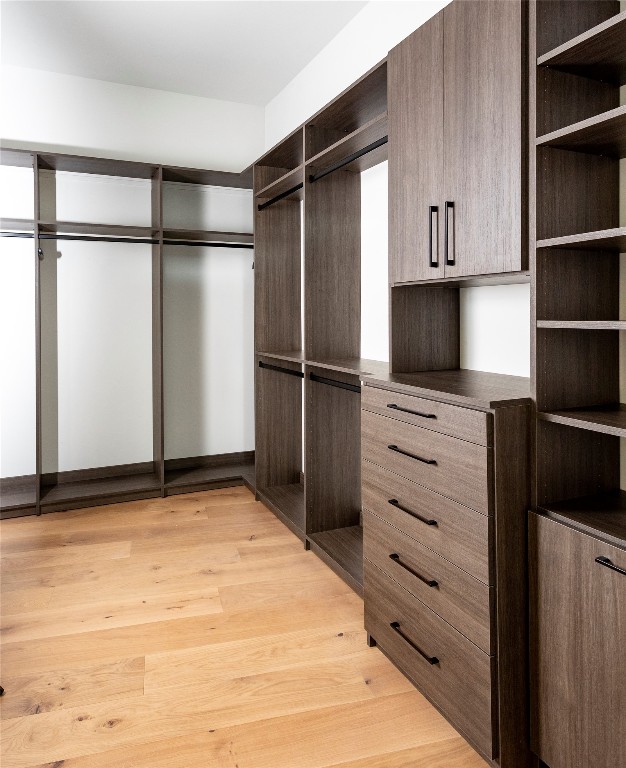 2209 South 1st Street, Unit 408 Austin, TX 78704 - Photo 15 of 28 a view of a refrigerator in kitchen and white cabinets