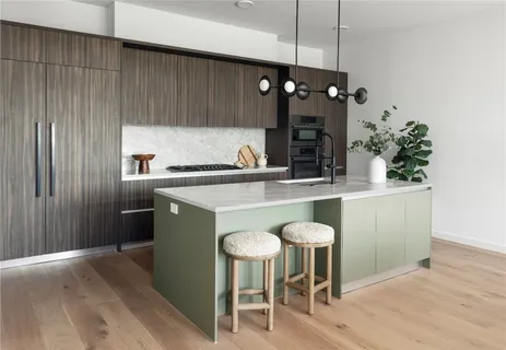 a kitchen with a table and chairs