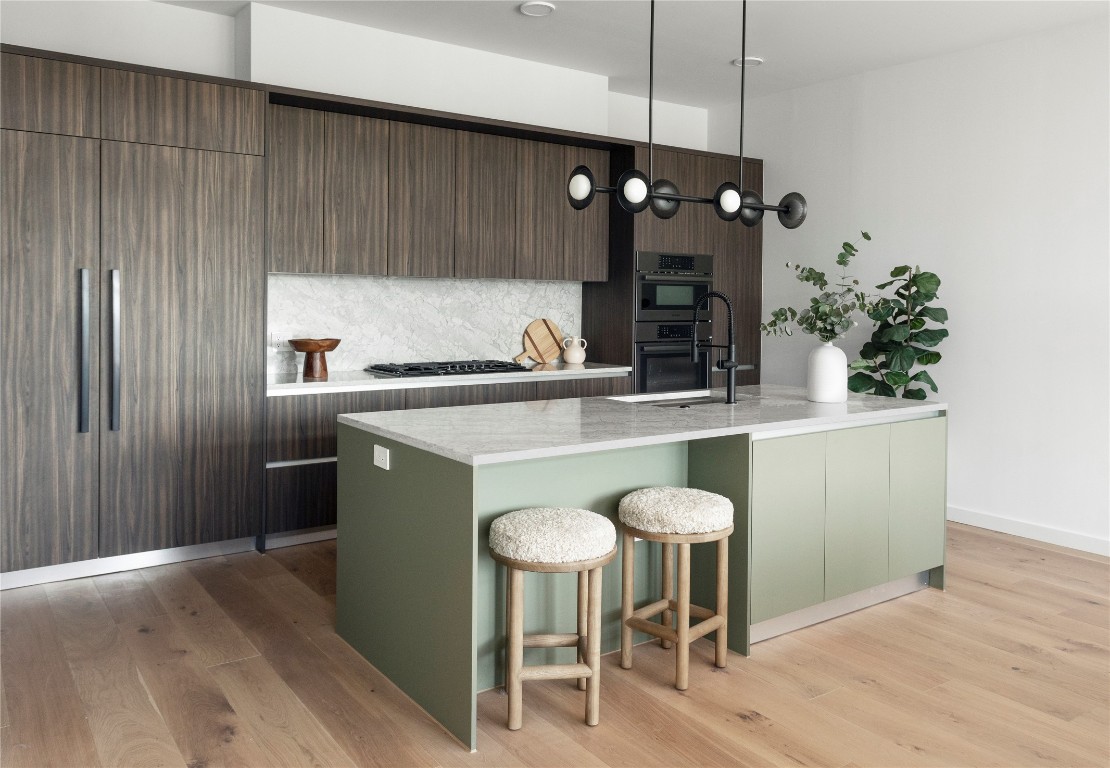 2209 South 1st Street, Unit 408 Austin, TX 78704 - Photo 7 of 28 a kitchen with a table and chairs