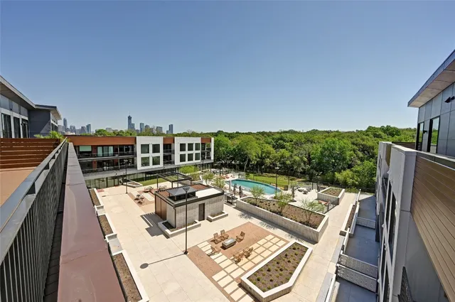 swimming pool view with a seating space
