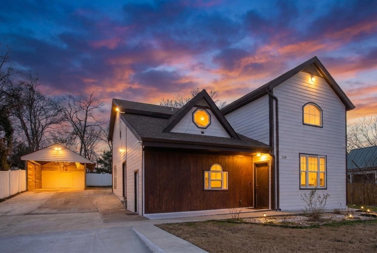 a front view of a house with a yard