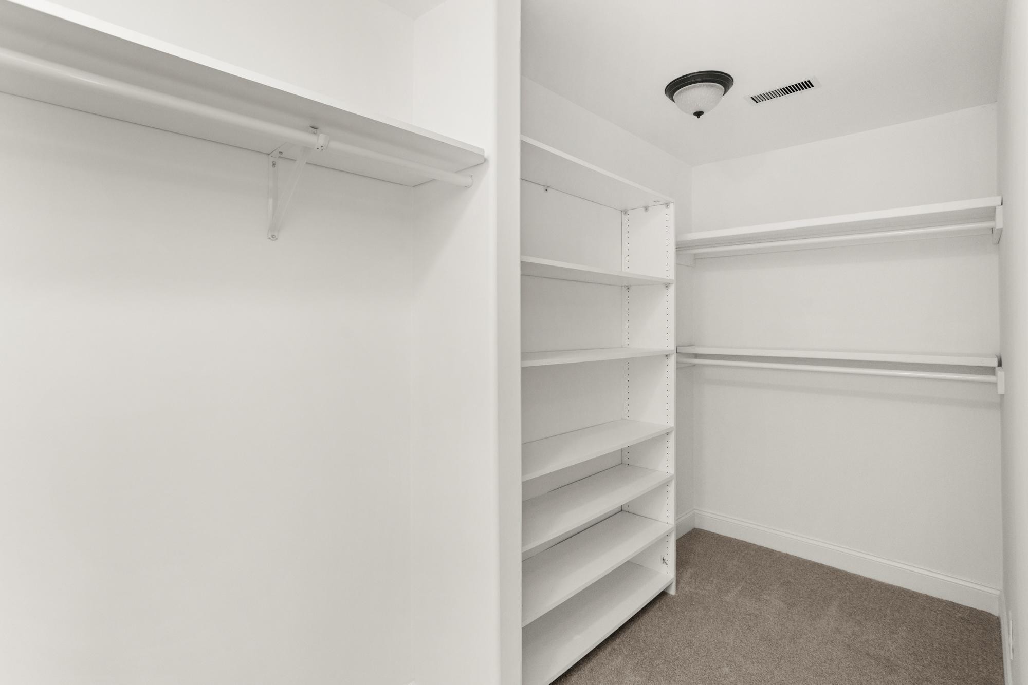 239 East Bledsoe Street Gallatin, TN 37066 - Photo 15 of 52 a view of walk in closet with empty racks