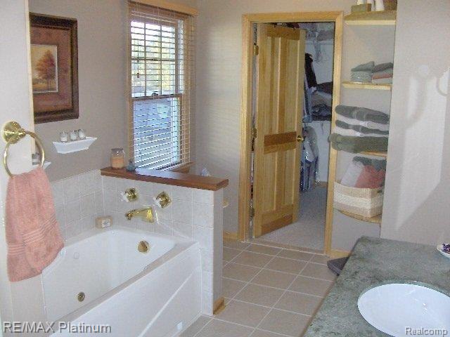 9385 Pierson Road Fowlerville, MI 48836 - Photo 9 of 11 MBTH W/JETTED TUB & W/I CLOSET