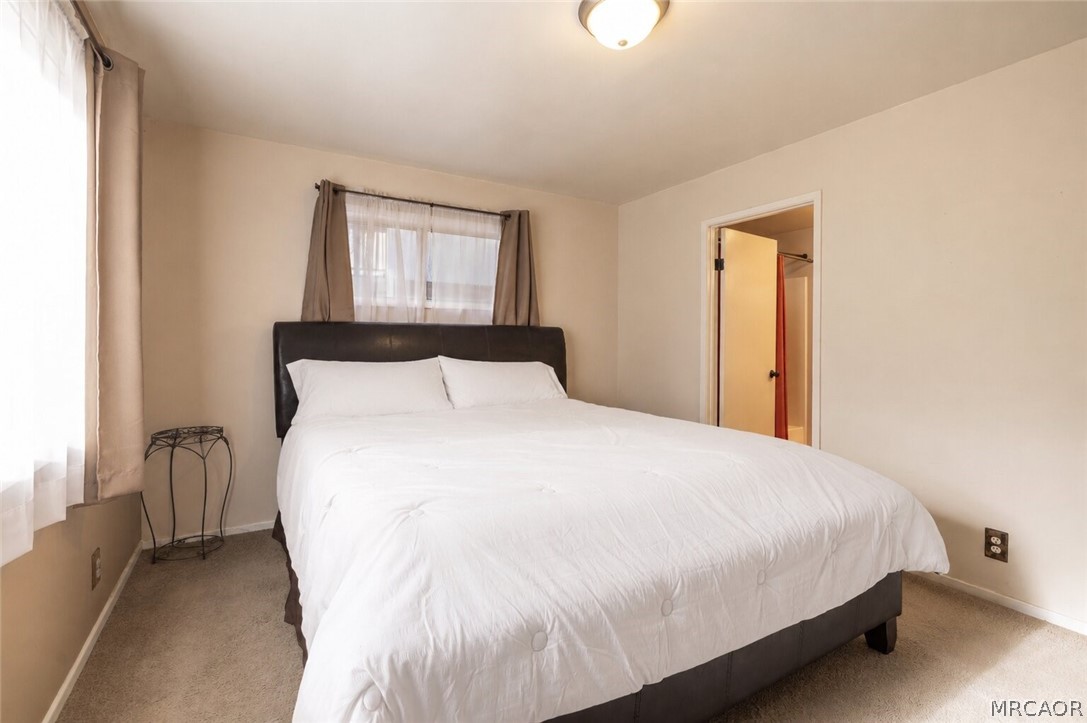 773 Sunset Lane Sugarloaf, CA 92386 - Photo 12 of 33 a bedroom with a bed and a window