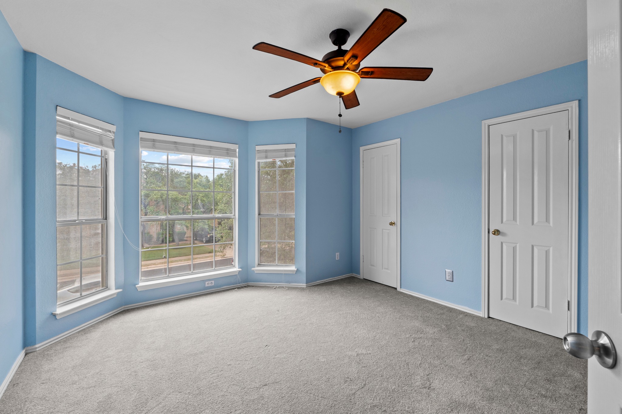 8605 Axis Drive Austin, TX 78749 - Photo 26 of 38 A quiet bedroom retreat with bay windows and an elegant ceiling fan.
