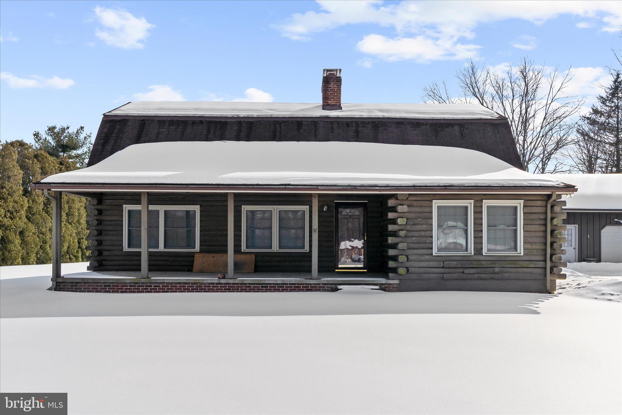 a front view of a house with a porch