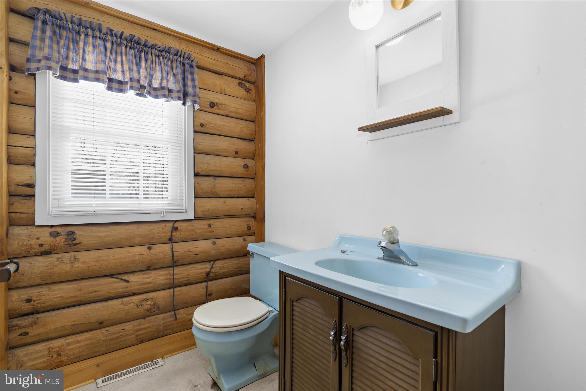 974 Telegraph Road Rising Sun, MD 21911 - Photo 12 of 61 a bathroom with a sink a toilet and a mirror