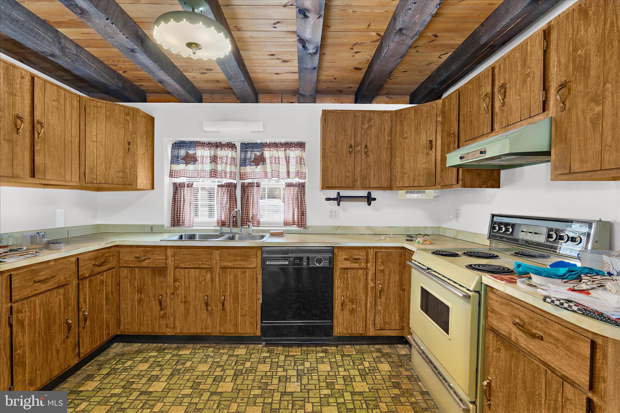 974 Telegraph Road Rising Sun, MD 21911 - Photo 15 of 61 a kitchen with a sink stove and cabinets