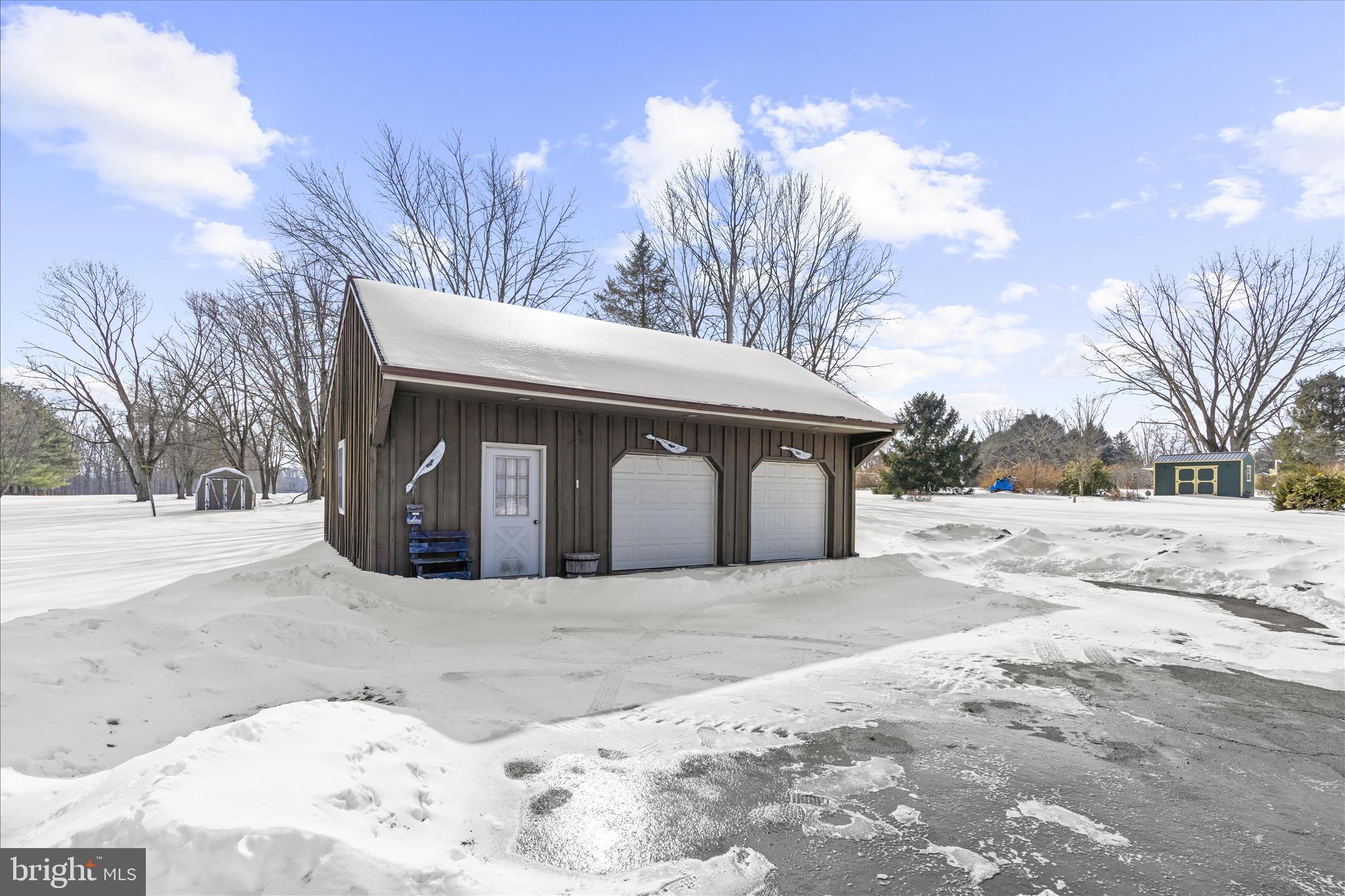 974 Telegraph Road Rising Sun, MD 21911 - Photo 36 of 61 a front view of a house with a yard covered in snow