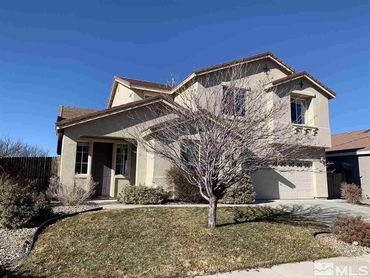 10451 Blockade Drive Reno, NV 89521 - Photo 1 of 36 a front view of a house with a yard