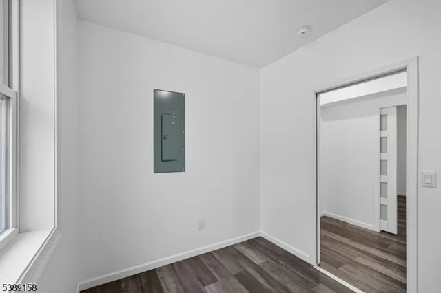 a room that has a window and wooden floor