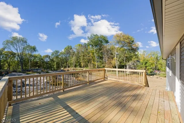 a view of a balcony with wooden floor