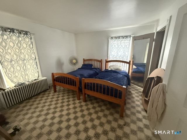 60 Capitol Avenue Meriden, CT 06451 - Photo 18 of 30 a bedroom with furniture and a window