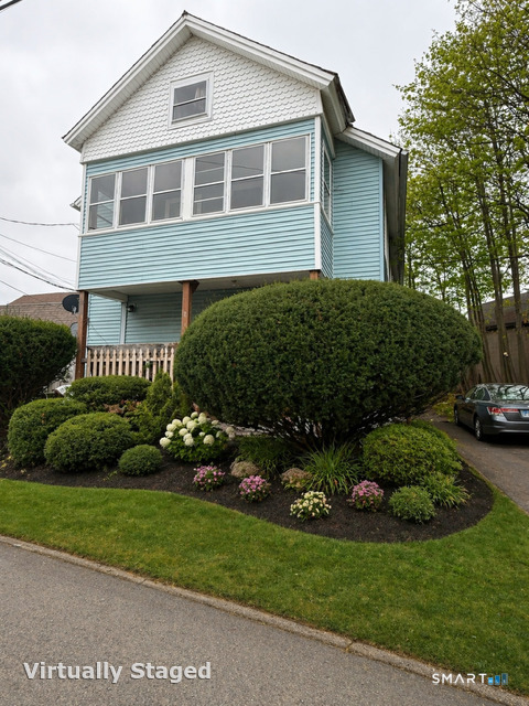 60 Capitol Avenue Meriden, CT 06451 - Photo 2 of 30 a front view of a house with a garden