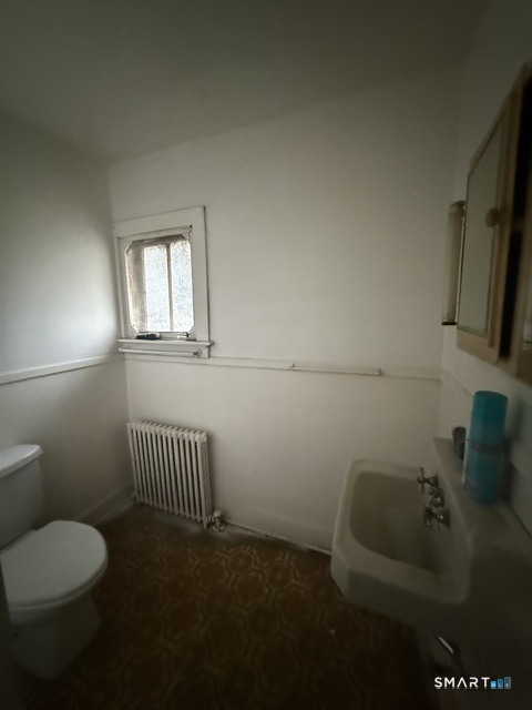 60 Capitol Avenue Meriden, CT 06451 - Photo 24 of 30 a bathroom with a toilet