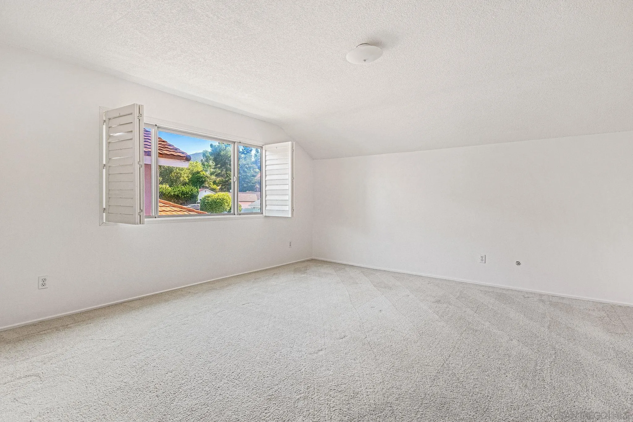 1983 David Drive Escondido, CA 92026 - Photo 19 of 55 an empty room with windows