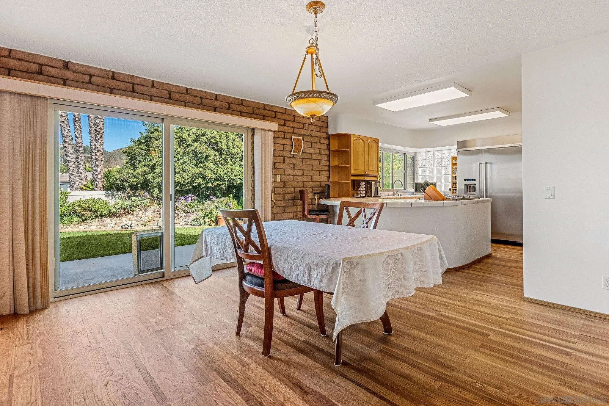1983 David Drive Escondido, CA 92026 - Photo 25 of 55 a view of a dining room with furniture wooden floor and chandelier