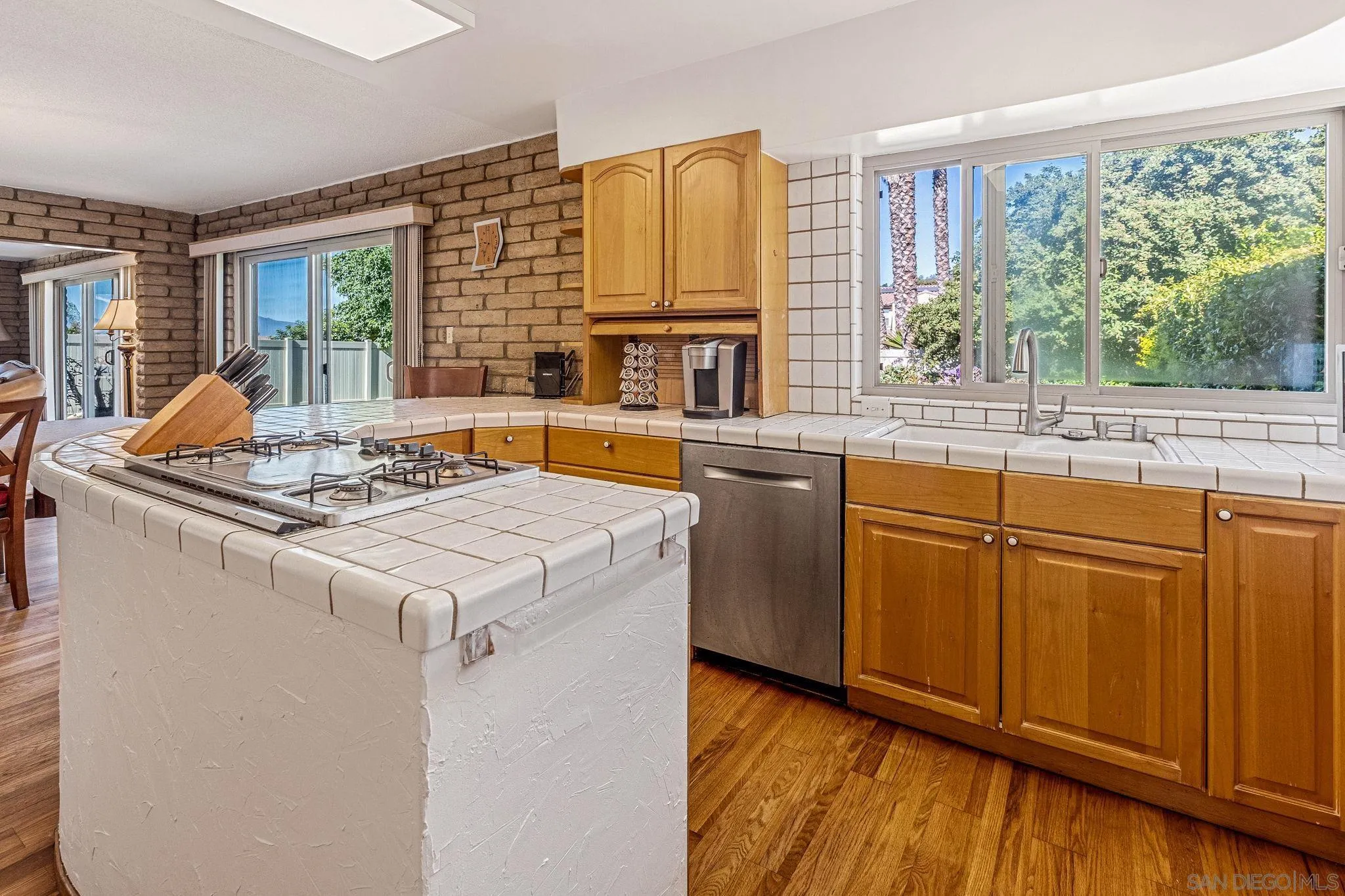 1983 David Drive Escondido, CA 92026 - Photo 28 of 55 a kitchen with stainless steel appliances granite countertop a stove a sink and a refrigerator
