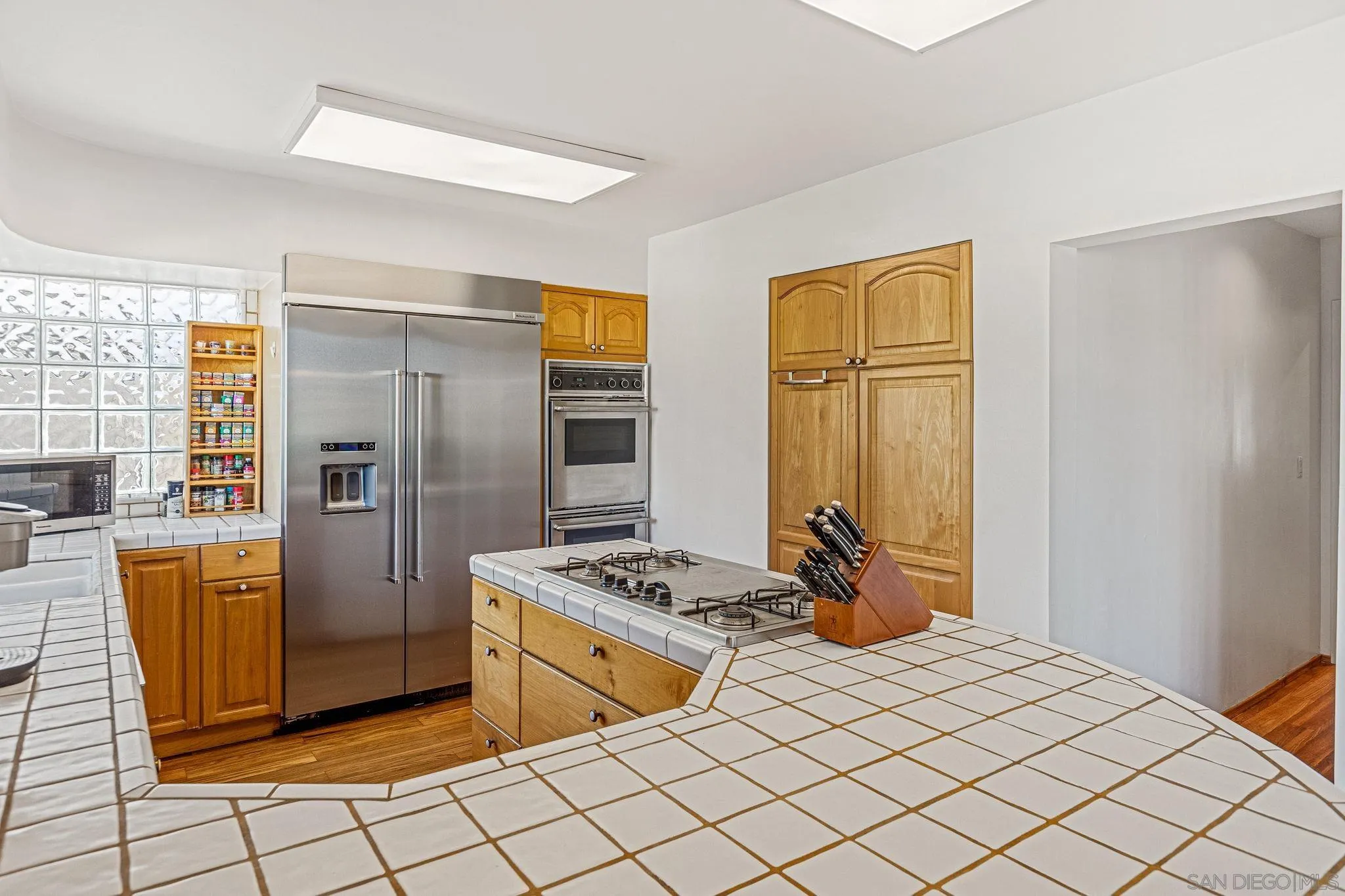 1983 David Drive Escondido, CA 92026 - Photo 30 of 55 a kitchen with stainless steel appliances a refrigerator and a stove