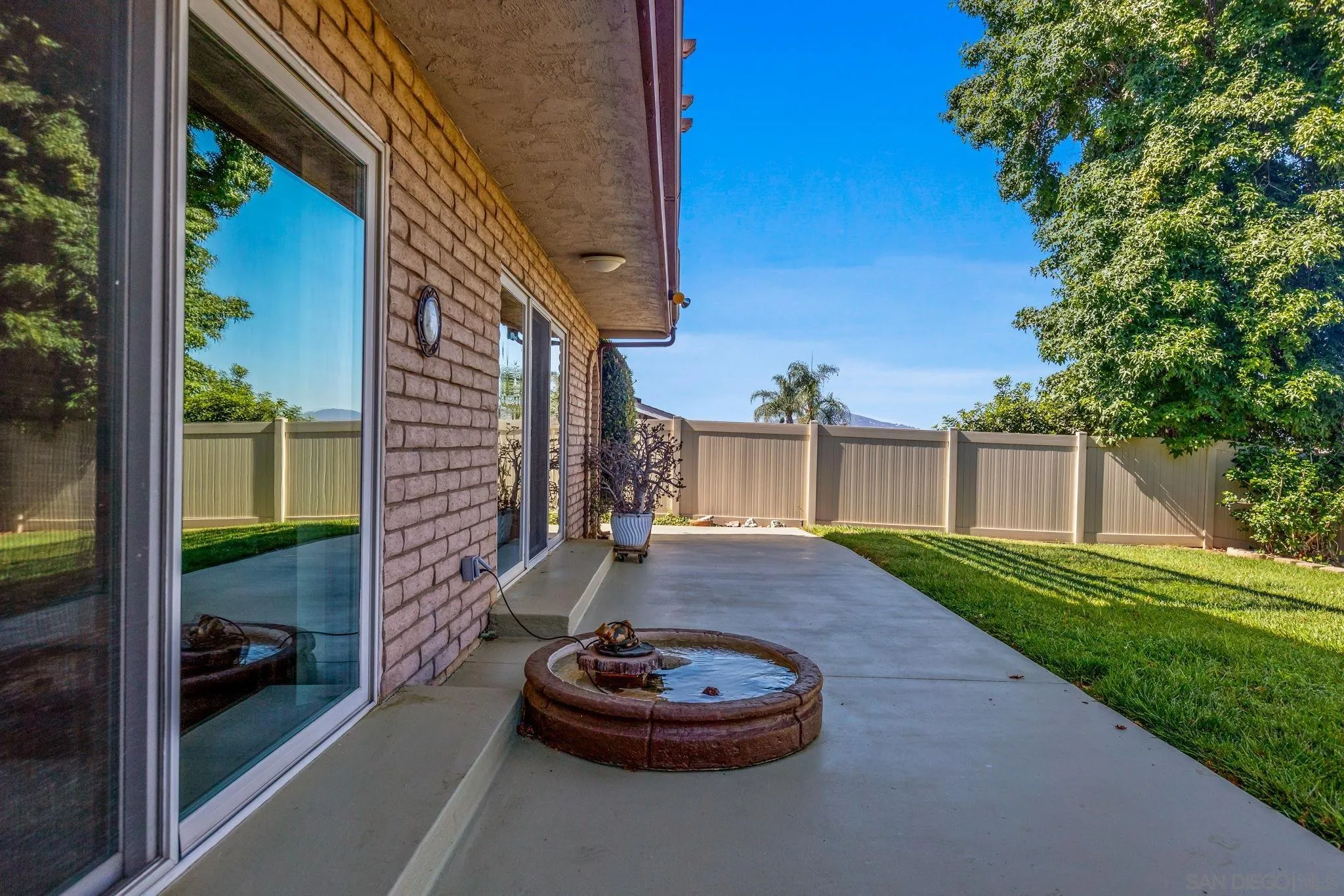 1983 David Drive Escondido, CA 92026 - Photo 43 of 55 a backyard of a house with a fountain and a fire pit