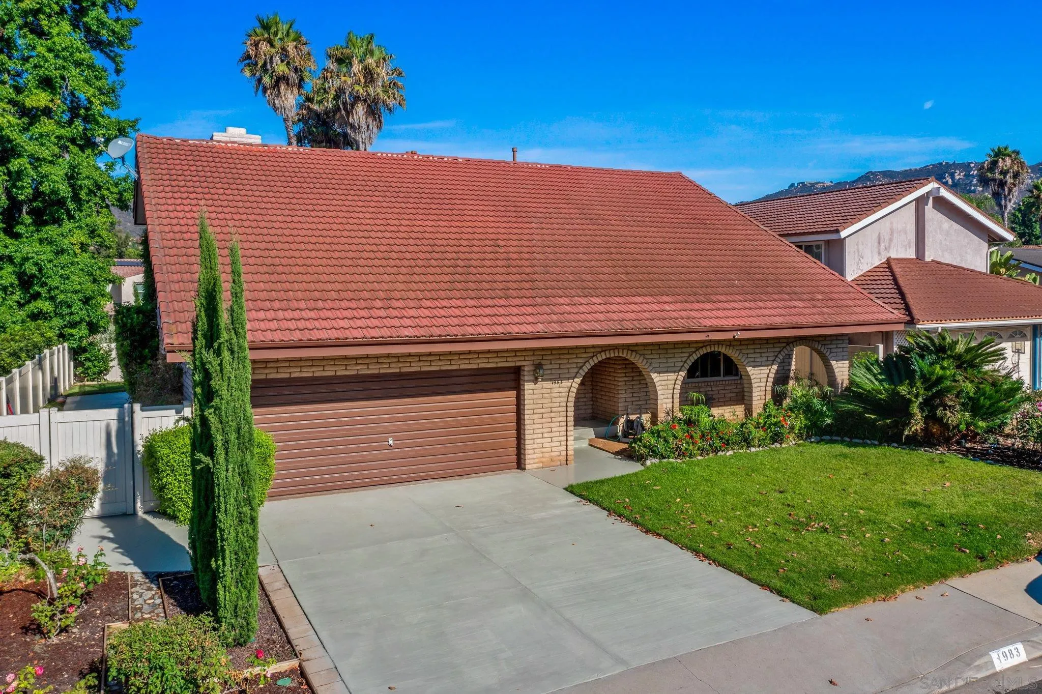 1983 David Drive Escondido, CA 92026 - Photo 45 of 55 a front view of a house with a yard and garage
