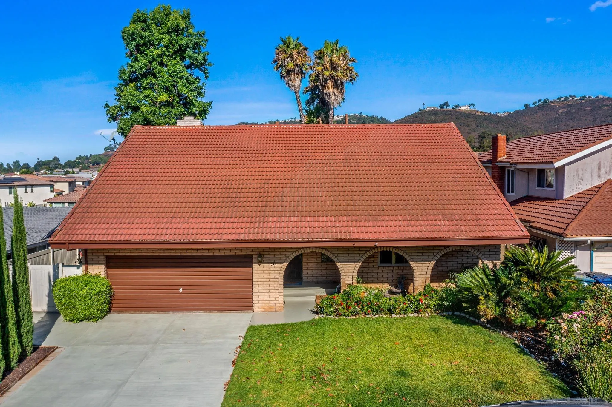 1983 David Drive Escondido, CA 92026 - Photo 46 of 55 a front view of a house with a yard and garage