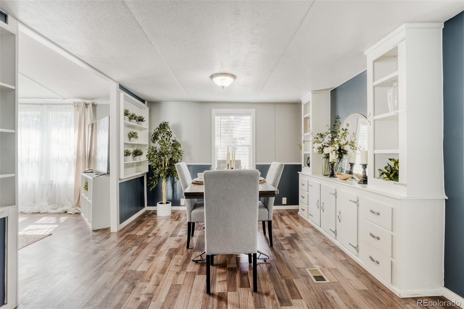 210 Pinto Street Golden, CO 80401 - Photo 15 of 35 a view of a dining room with furniture window and wooden floor