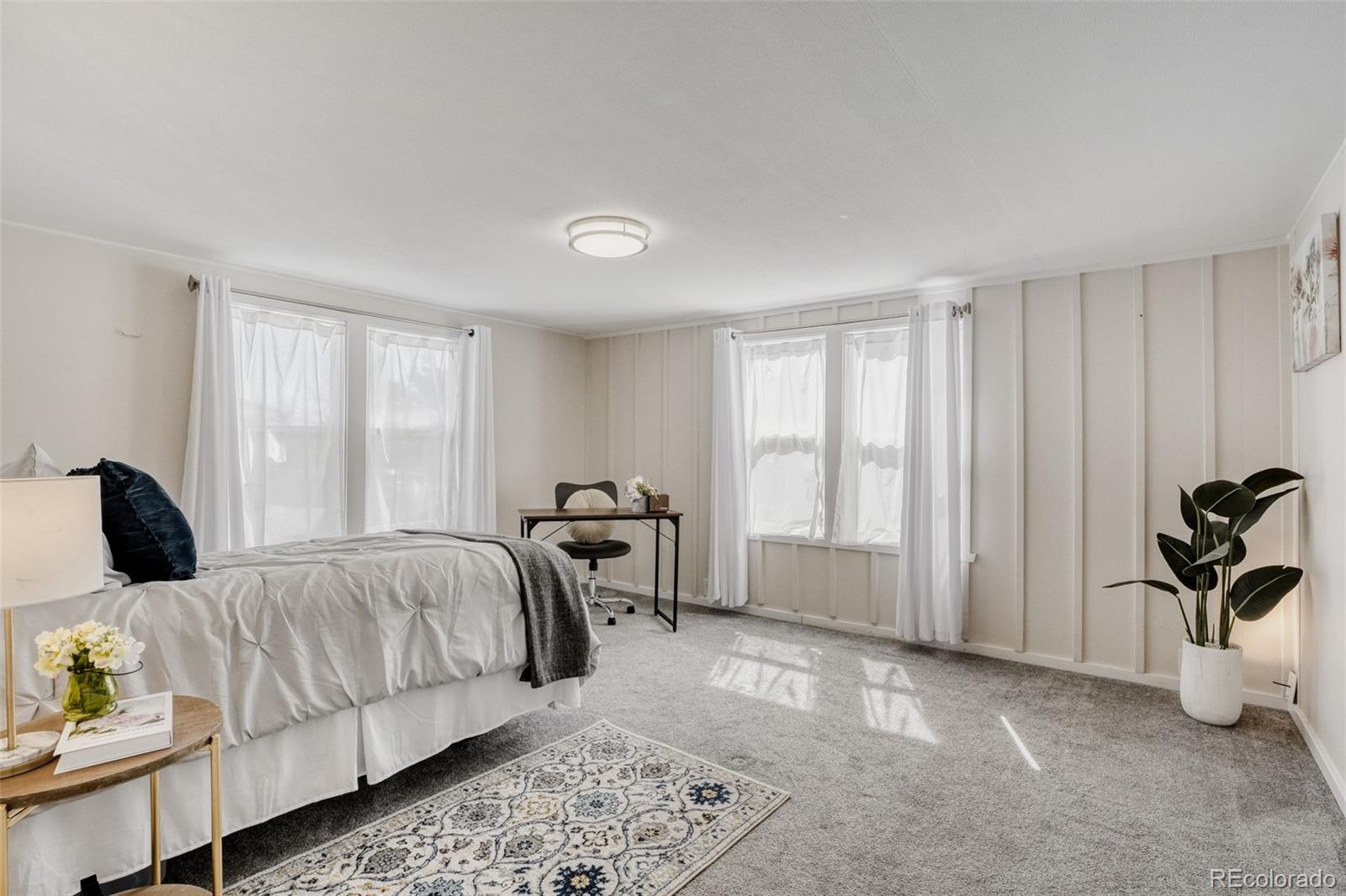 210 Pinto Street Golden, CO 80401 - Photo 20 of 35 a bedroom with a bed and a window