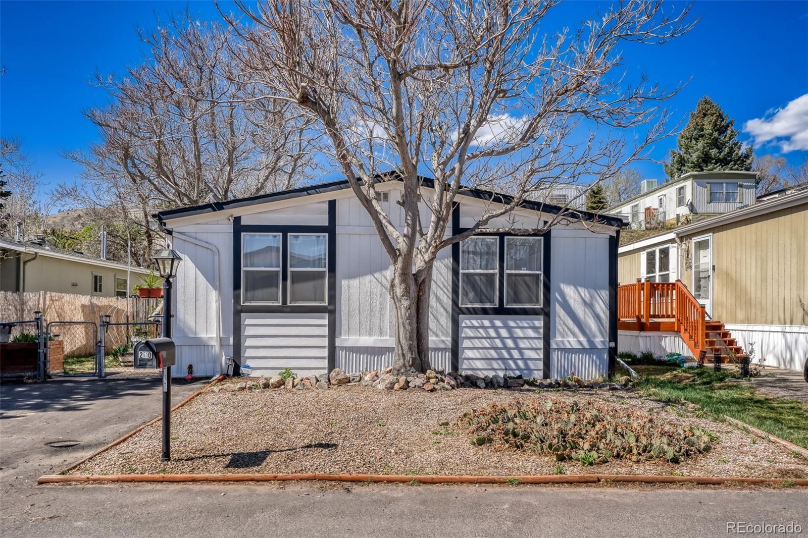 210 Pinto Street Golden, CO 80401 - Photo 2 of 35 a front view of a house with garden