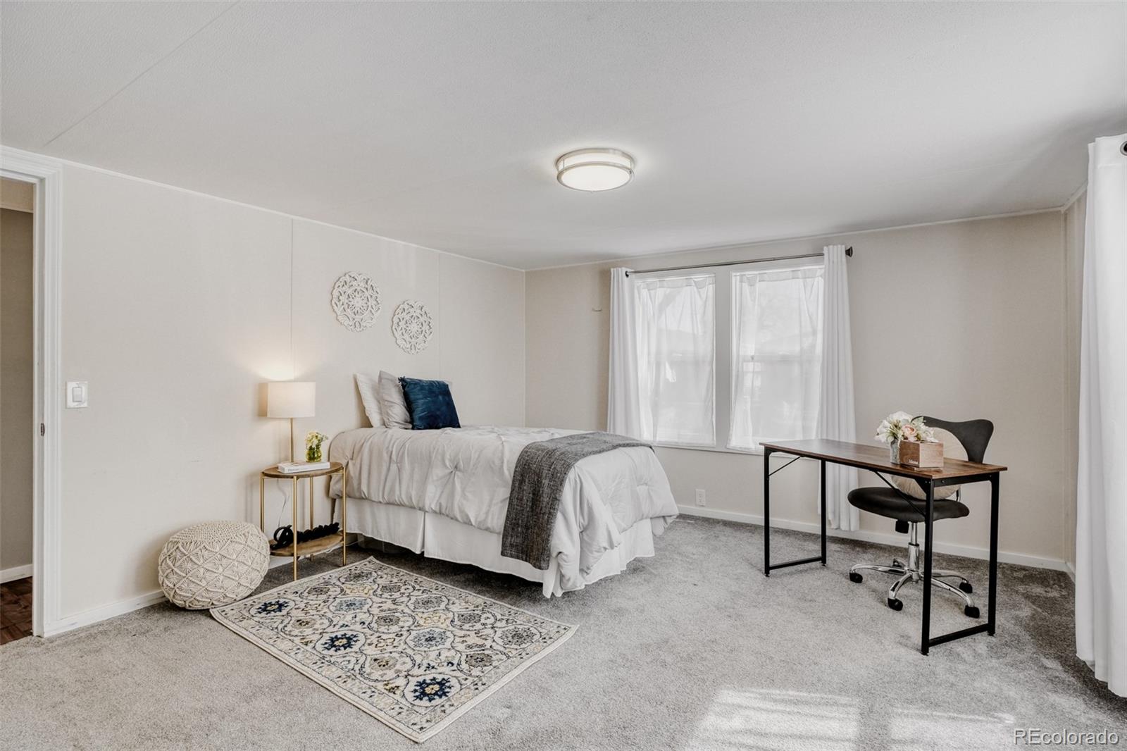 210 Pinto Street Golden, CO 80401 - Photo 21 of 35 a bedroom with a bed and a window