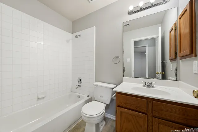 a bathroom with a sink a toilet and a bathtub