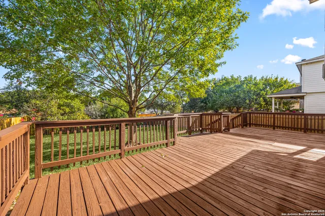 a view of deck with wooden floor and fence