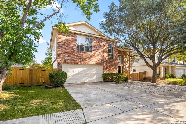 a view of a yard in front view of a house