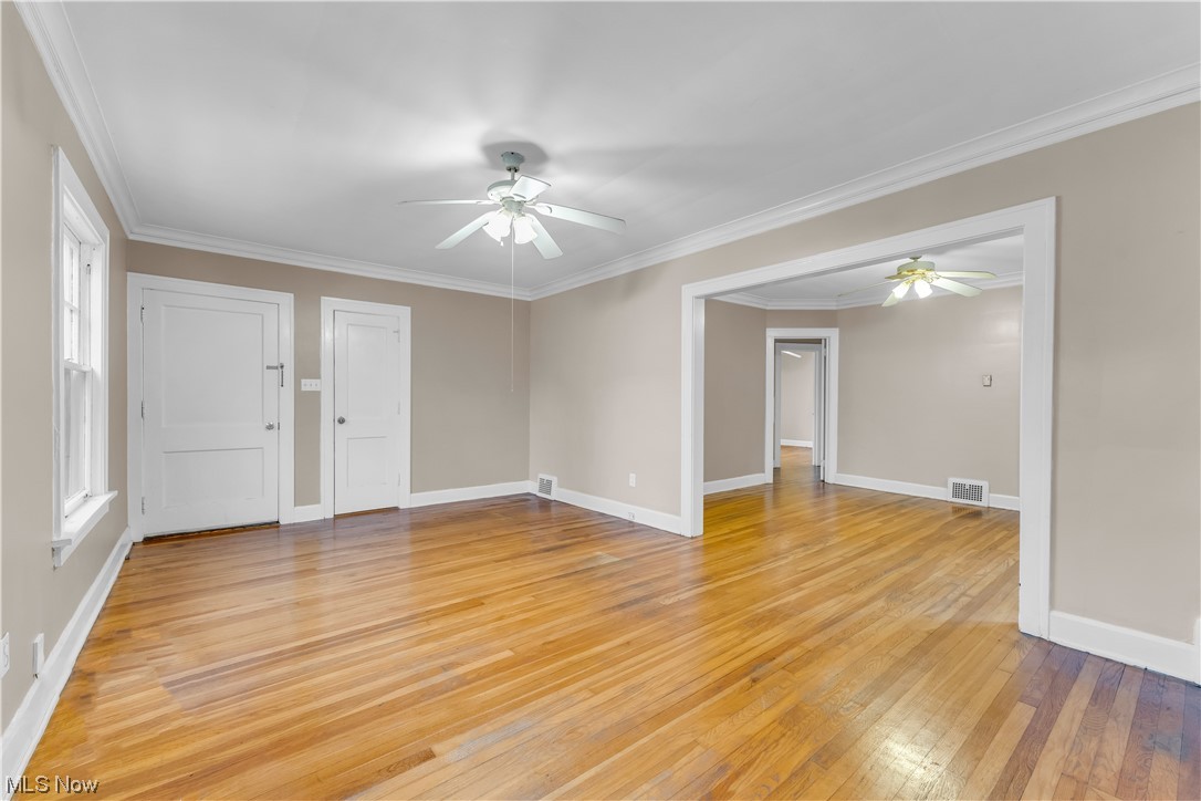 3609 Strandhill Road Shaker Heights, OH 44122 - Photo 33 of 47 Foyer featuring light wood-type flooring, ceiling fan, and ornamental molding