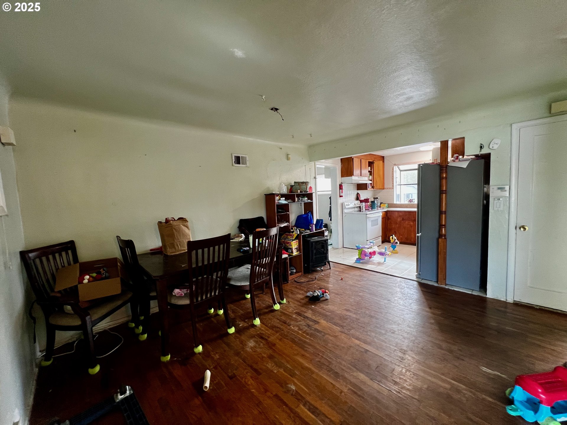 1271 Centennial Boulevard Springfield, OR 97477 - Photo 4 of 10 a view of a dining room with furniture and wooden floor