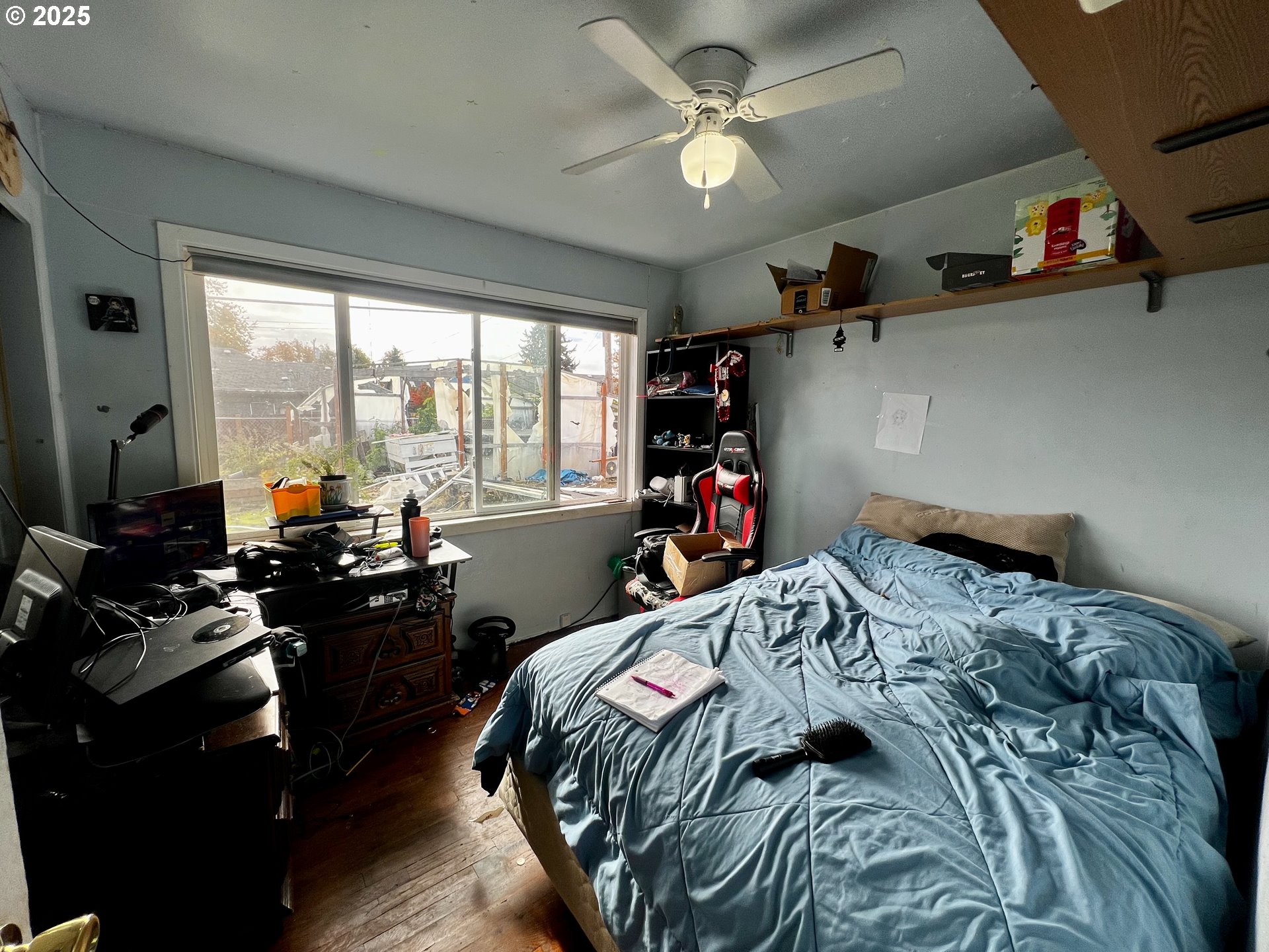 1271 Centennial Boulevard Springfield, OR 97477 - Photo 7 of 10 a bed sitting in a bedroom next to a window