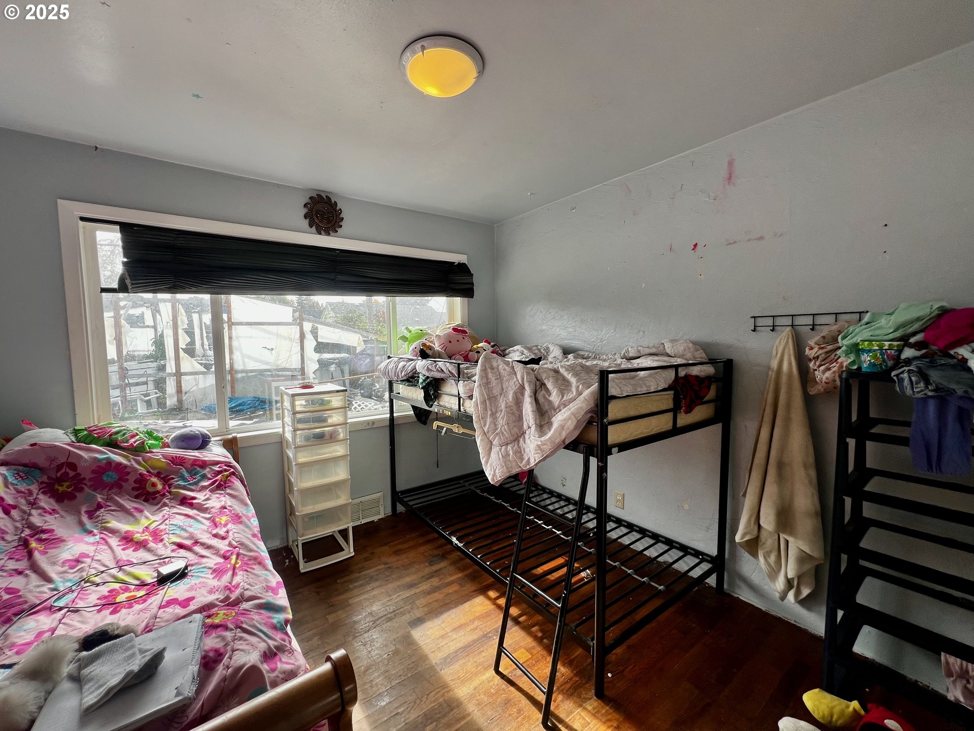 1271 Centennial Boulevard Springfield, OR 97477 - Photo 9 of 10 a bedroom with furniture and a large window