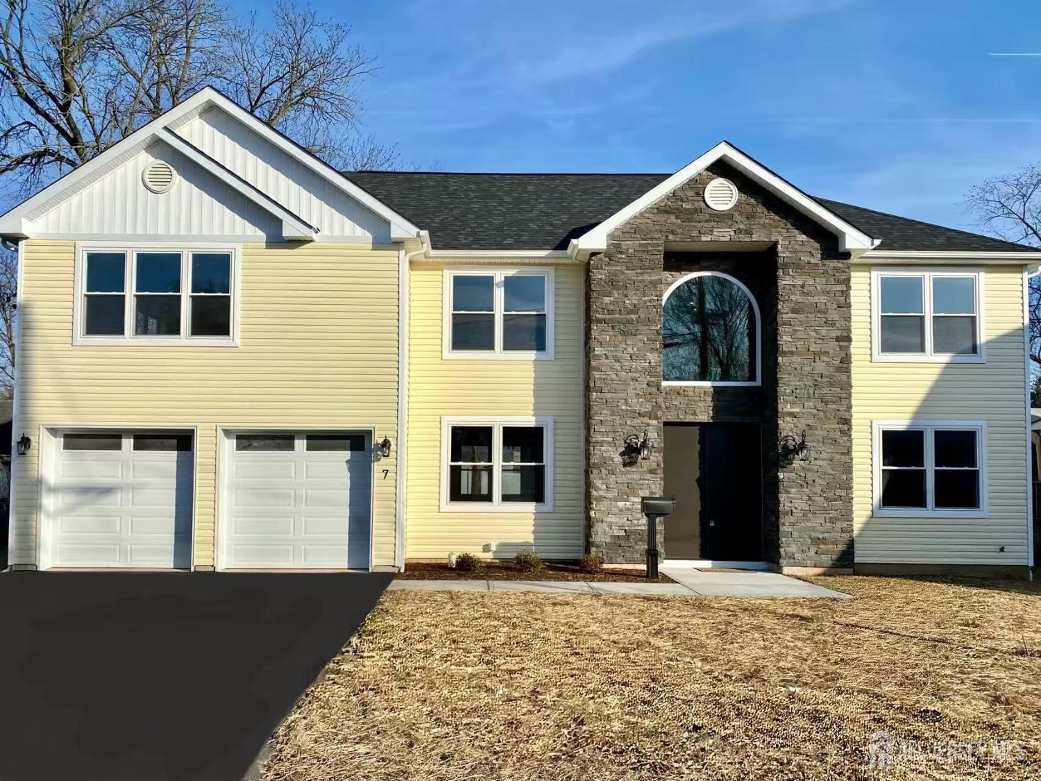 a front view of a house with a yard