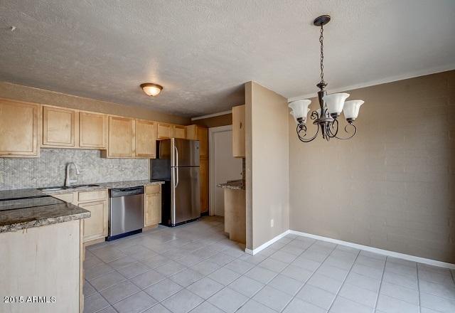 331 Hartford Road Kearny, AZ 85137 - Photo 32 of 40 a view of a kitchen with a sink and refrigerator