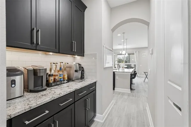 a view of a livingroom with wooden floor and stairs